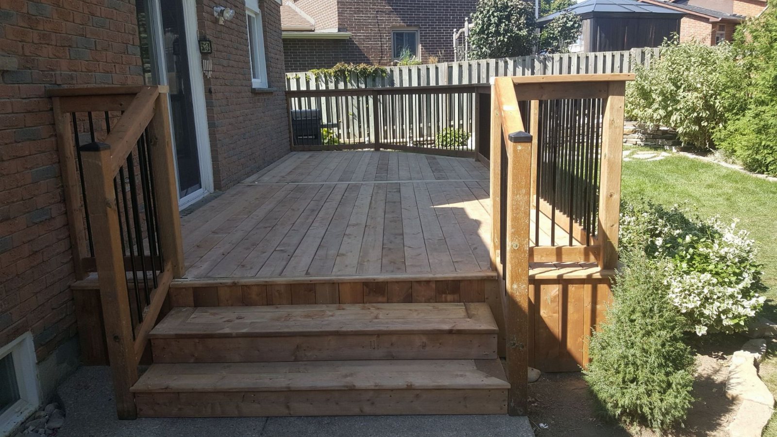 Wood deck with aluminum-spindle railings