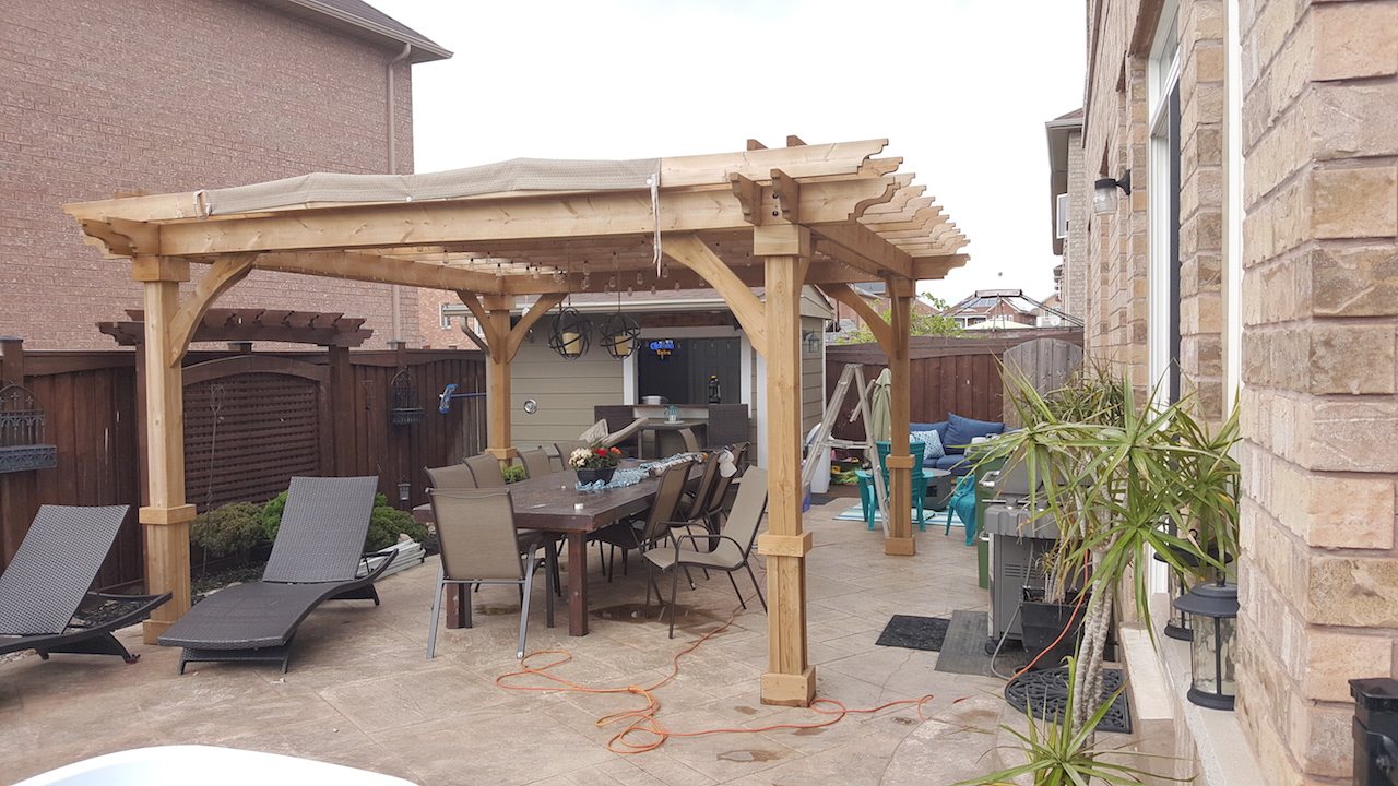 Cedar pergola over patio dining area
