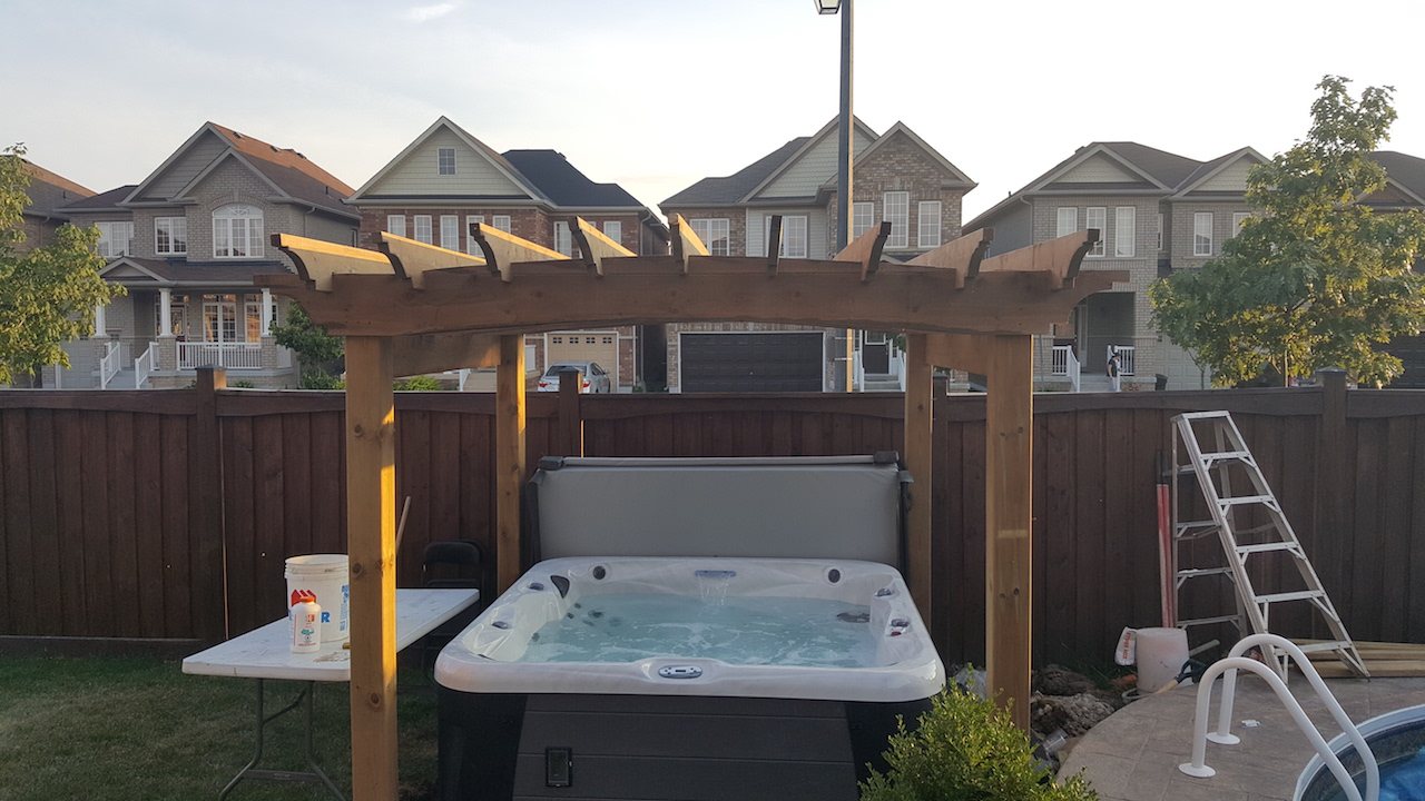 Arched pergola over hot tub
