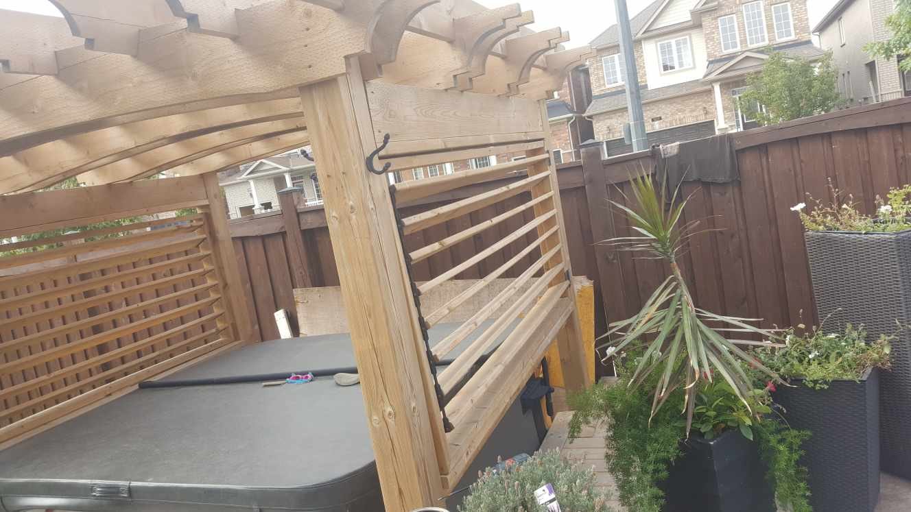 Louvred privacy screens & curved pergola