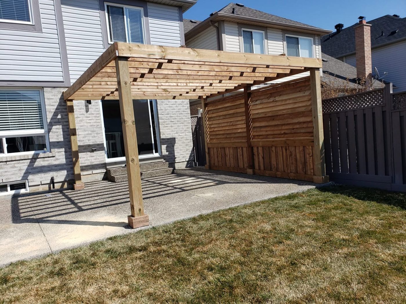 Poolside pergola with privacy screen