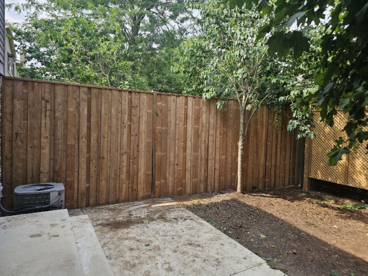 Cedar privacy fence with lattice screen