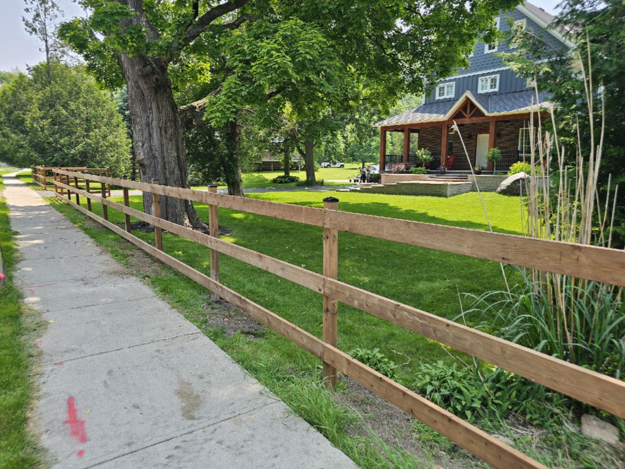 Three-rail cedar ranch fence